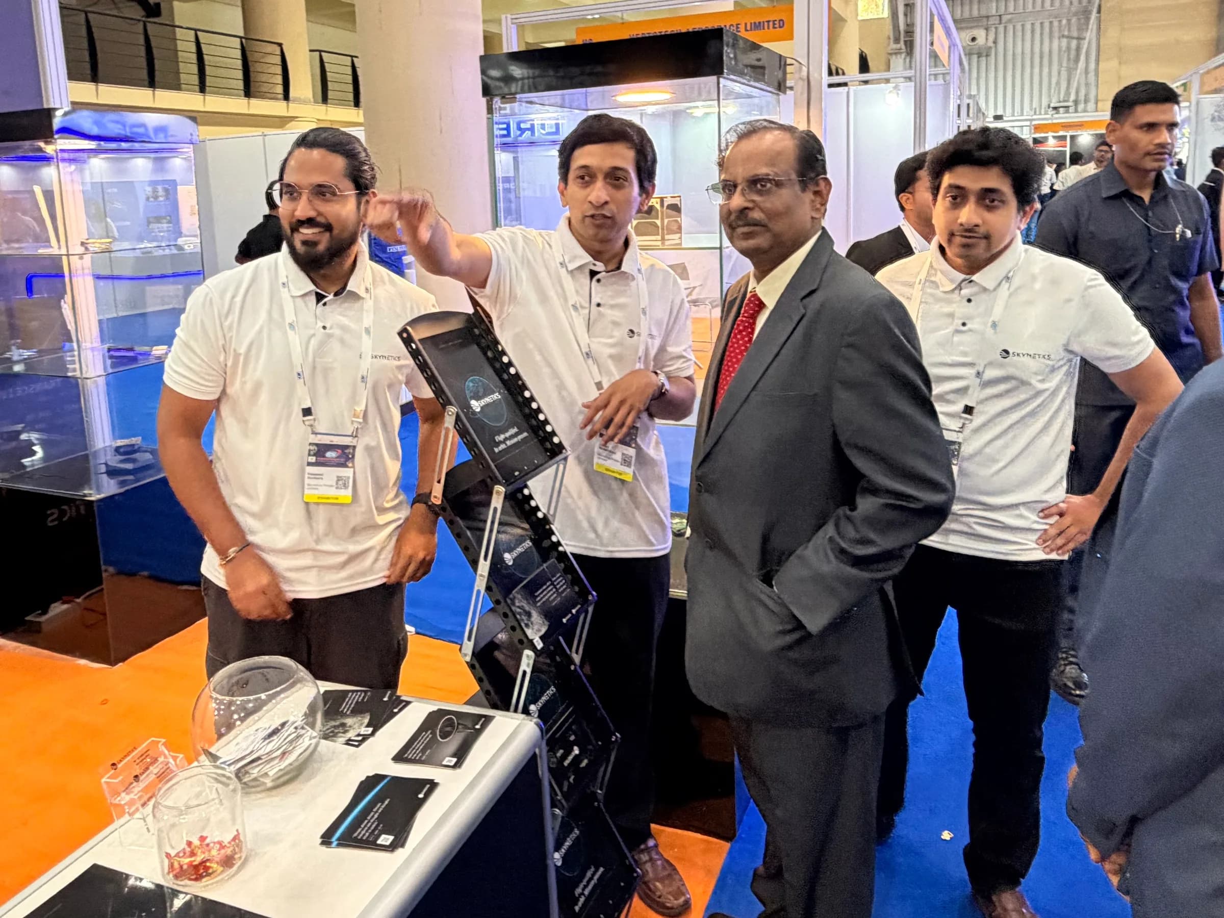 Dr. V. Narayanan with the Skynetics founders at the Skynetics booth